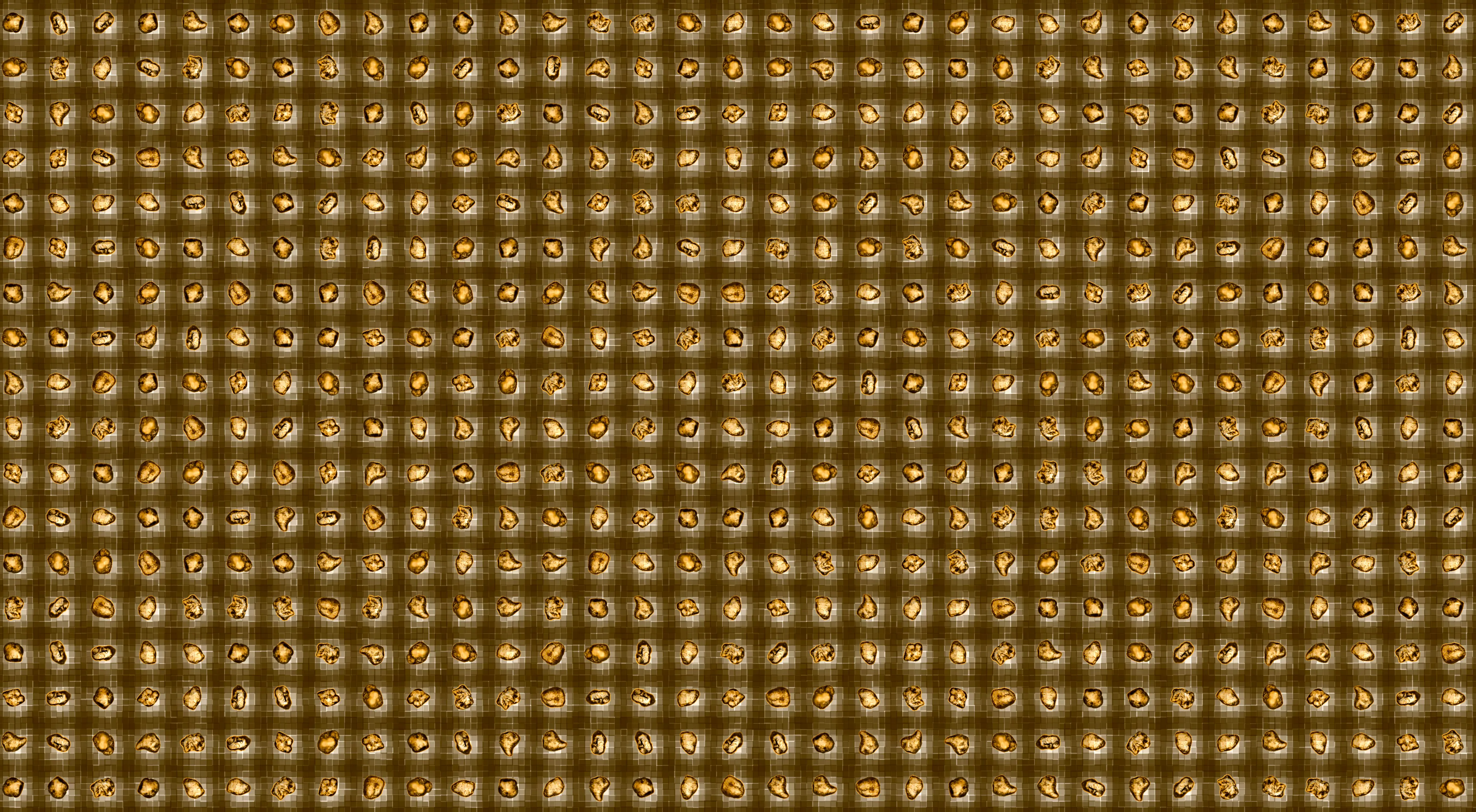 Sand grains are positioned in a grid to clearly define the spaces surrounding each grain. spaces between sand grains
